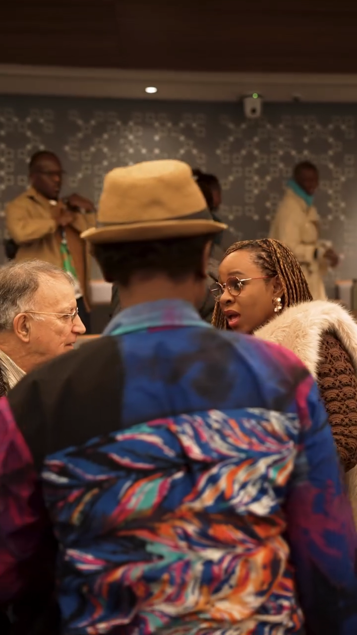 Bolanle Austen‑Peters in discussion with academic delegates.