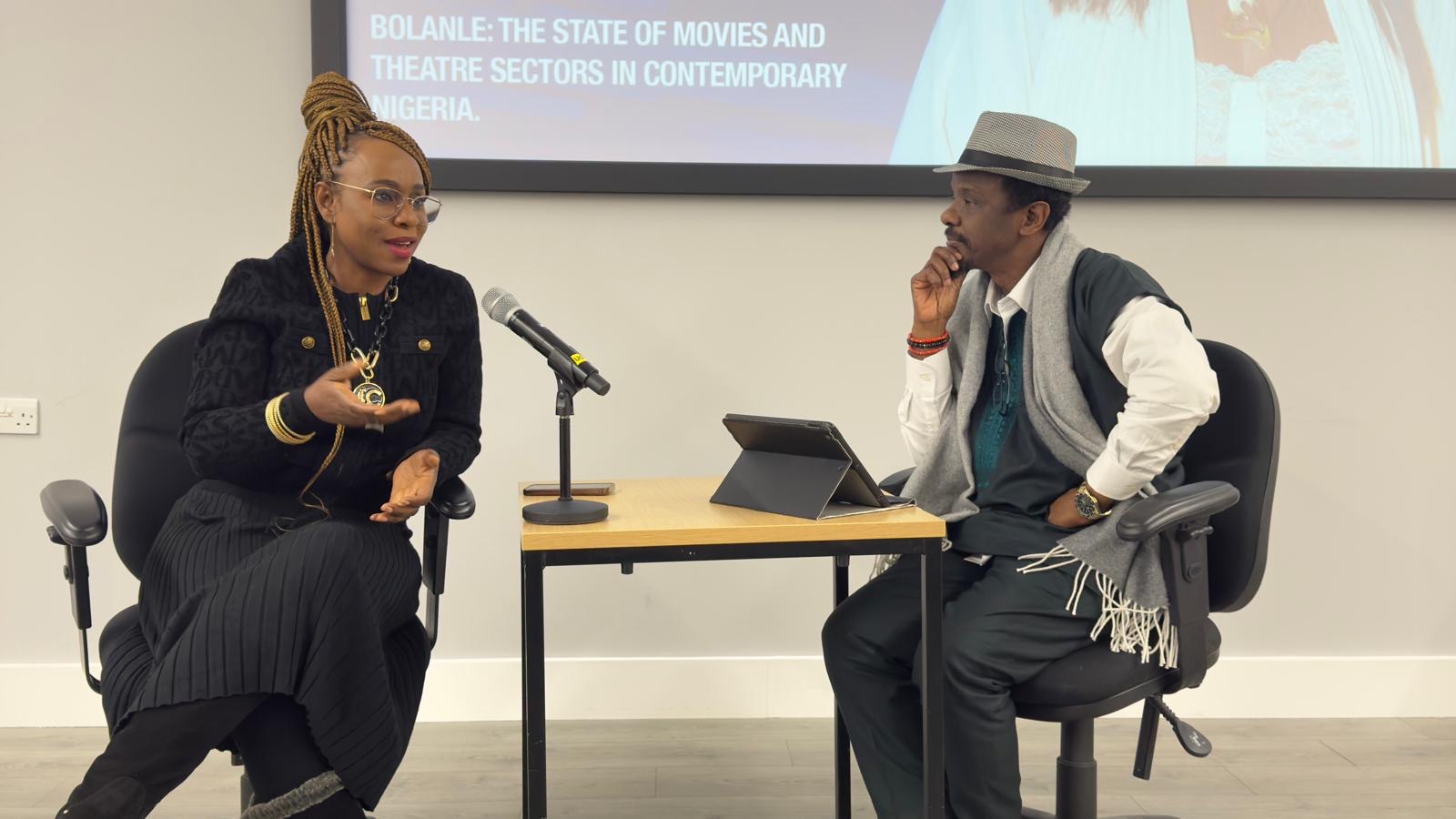 Bolanle Austen‑Peters speaking on stage at University of Westminster. BAP talks art, legacy & Nigerian storytelling