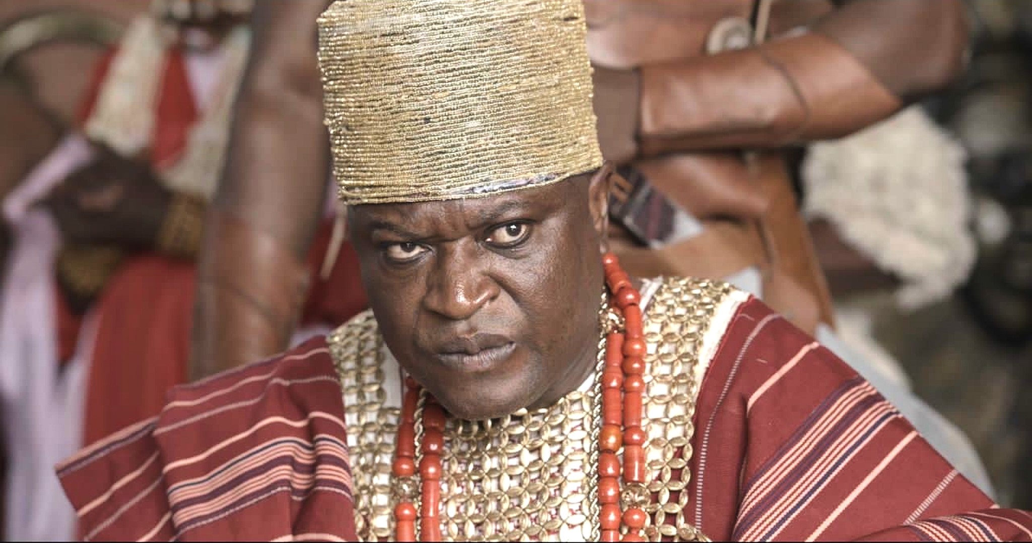 Femi Branch as Ga’a wearing intricate layered aso‑ofi costume design in House of Ga’a.