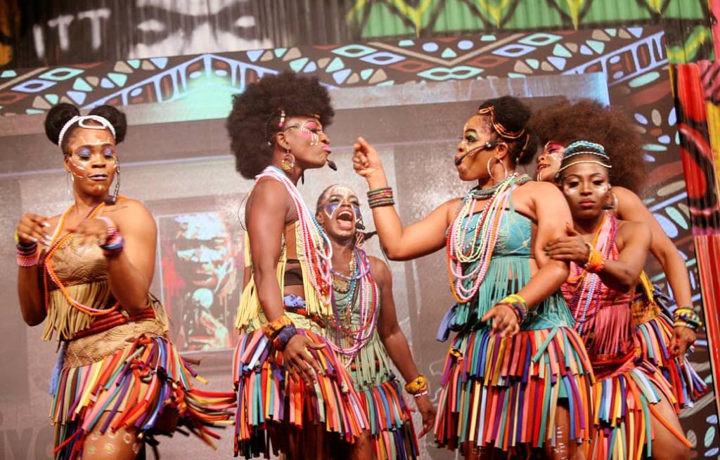 Still of women dancing representing the Kalakuta Queens stage play.